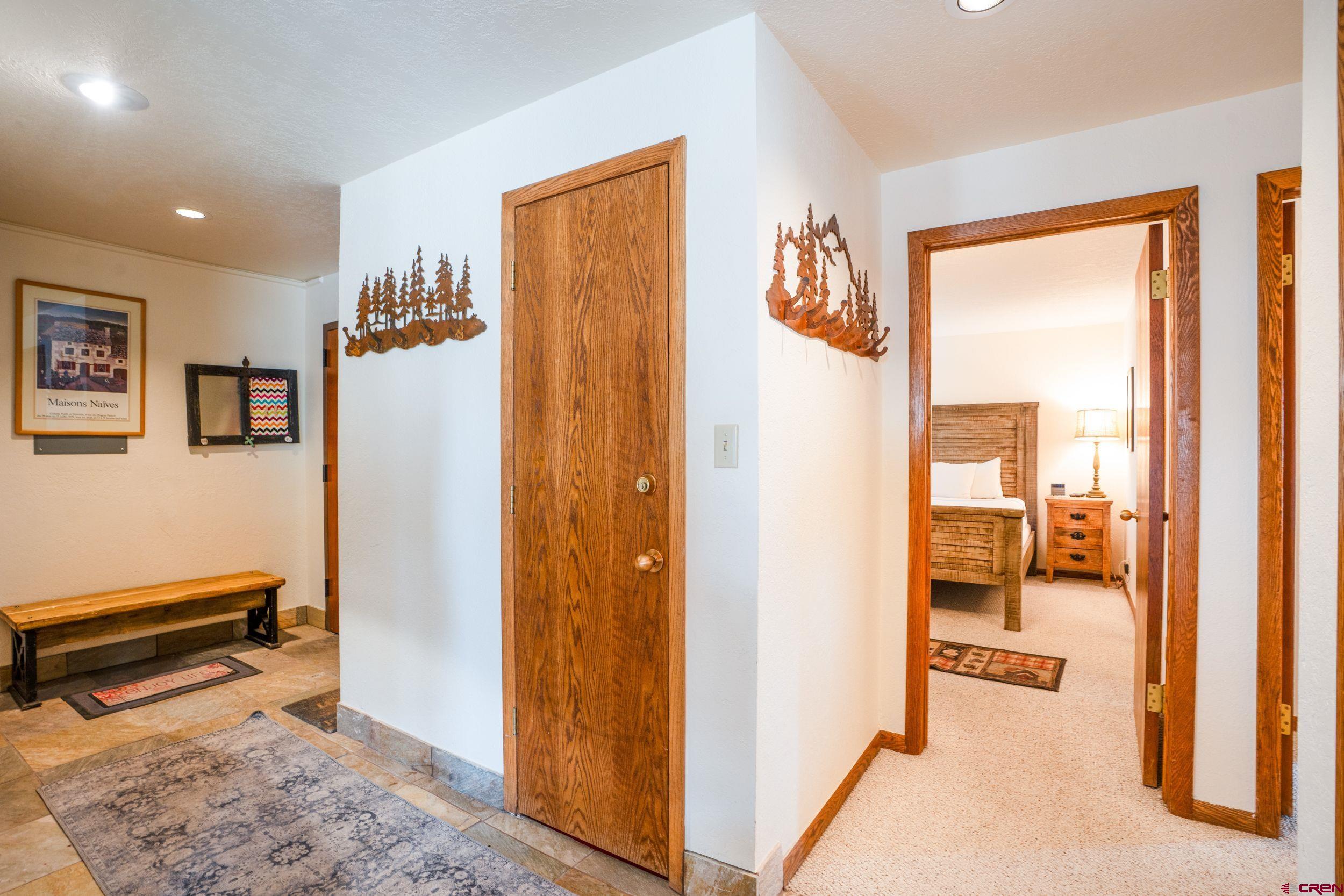 11 Snowmass Road, Unit 440 Crested Butte, CO 81225 - Photo 27 of 41 a view of a hallway with bathroom and wooden floor