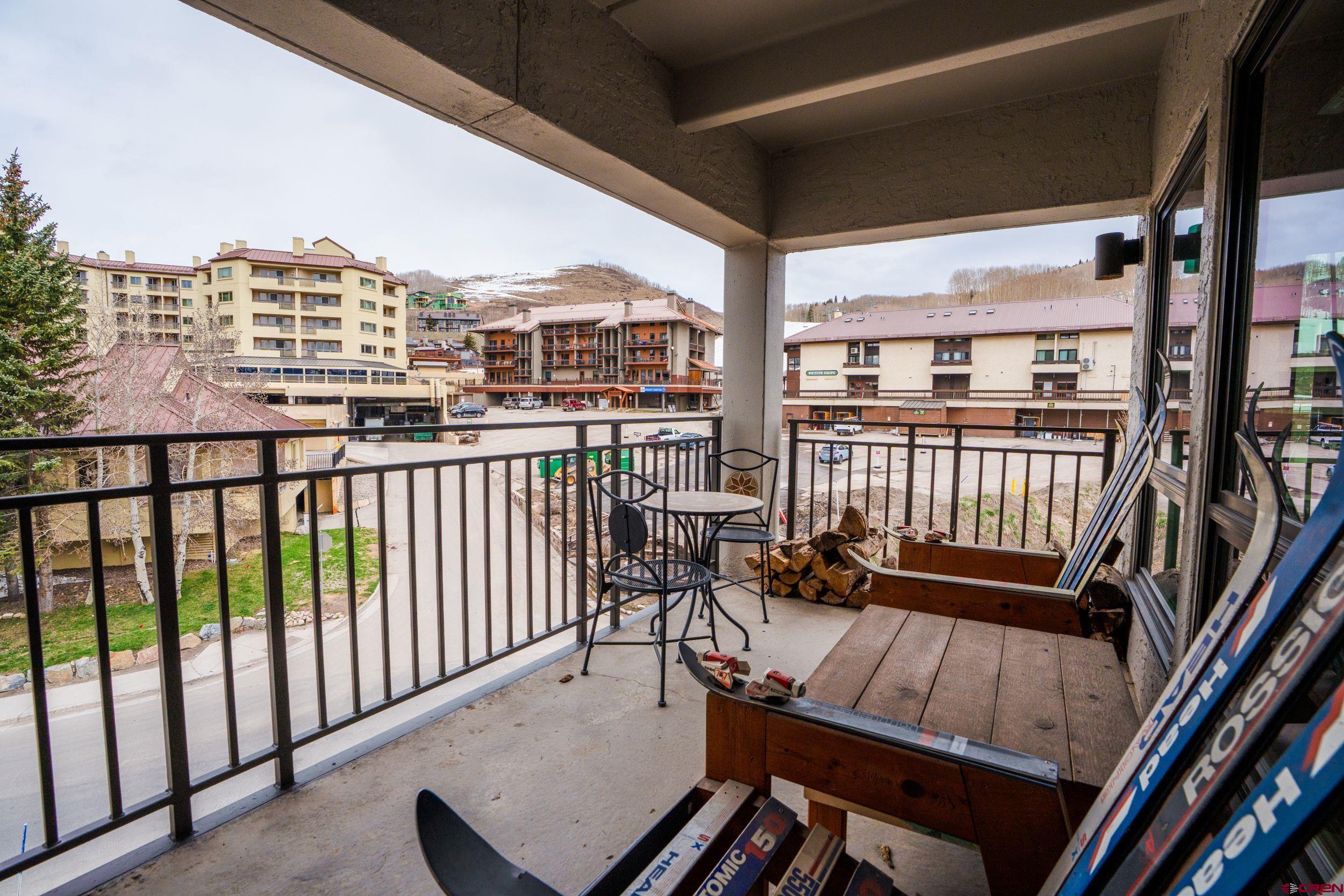 11 Snowmass Road, Unit 440 Crested Butte, CO 81225 - Photo 29 of 41 a view of a balcony with chairs
