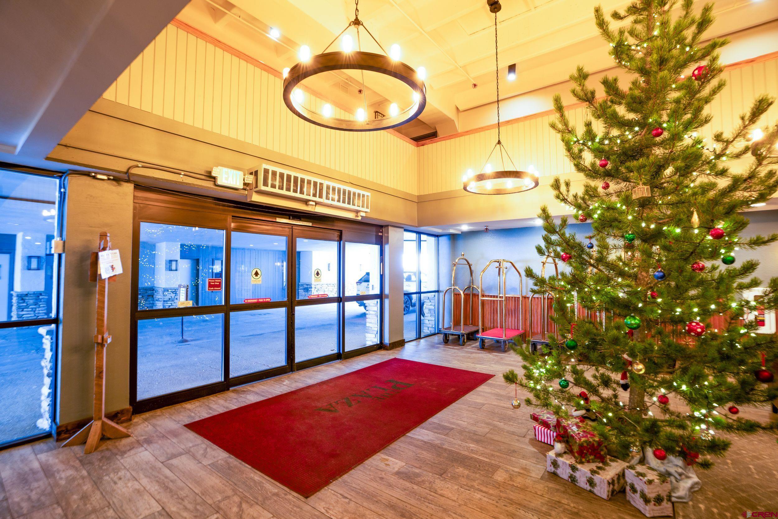 11 Snowmass Road, Unit 440 Crested Butte, CO 81225 - Photo 32 of 41 a view of a porch with a chandelier