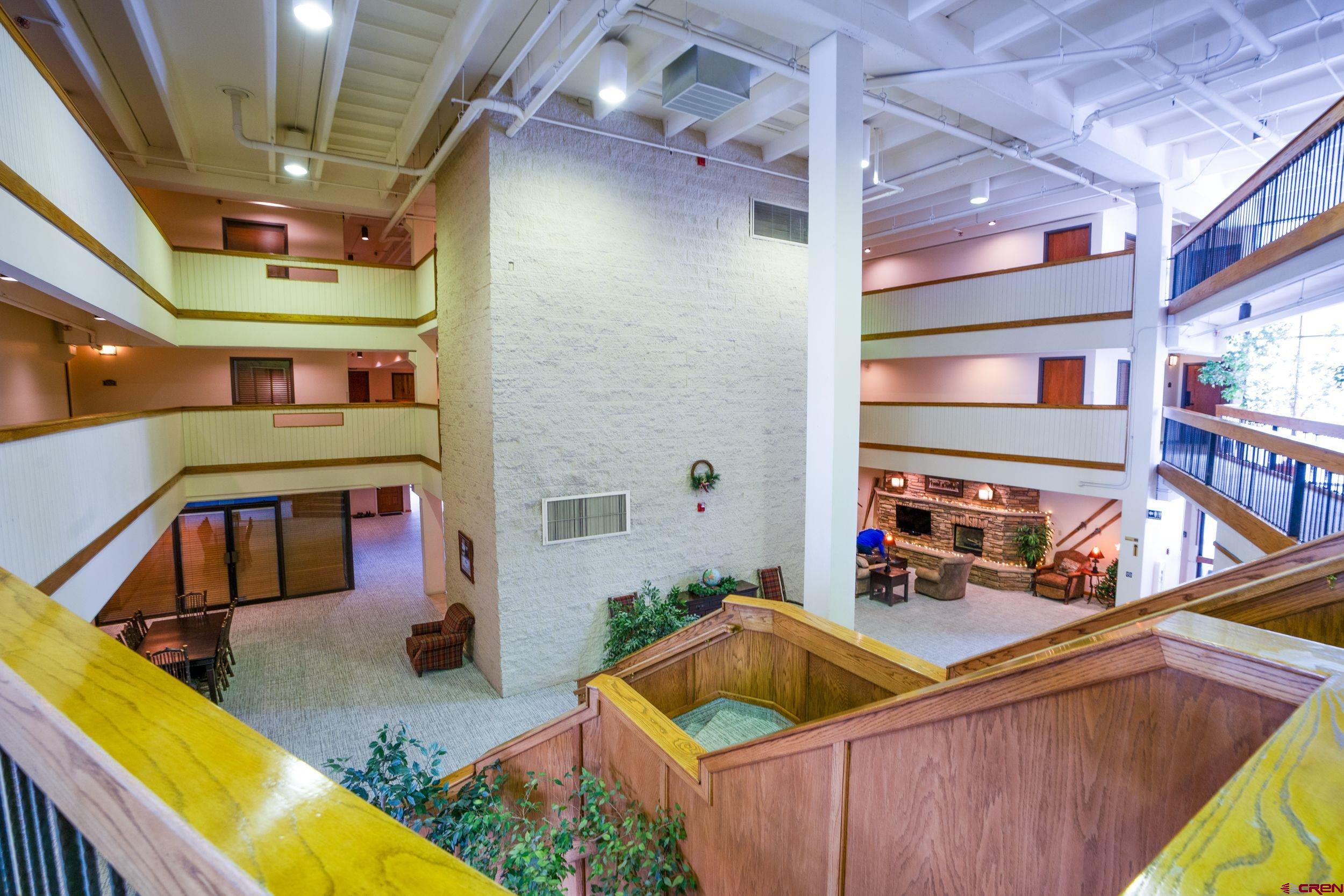 11 Snowmass Road, Unit 440 Crested Butte, CO 81225 - Photo 34 of 41 a kitchen with stainless steel appliances kitchen island granite countertop a sink and a blue cabinets