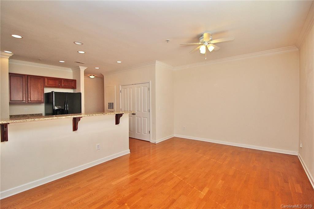 4154 Walker Road Charlotte, NC 28211 - Photo 12 of 37 a view of an empty room with a chandelier