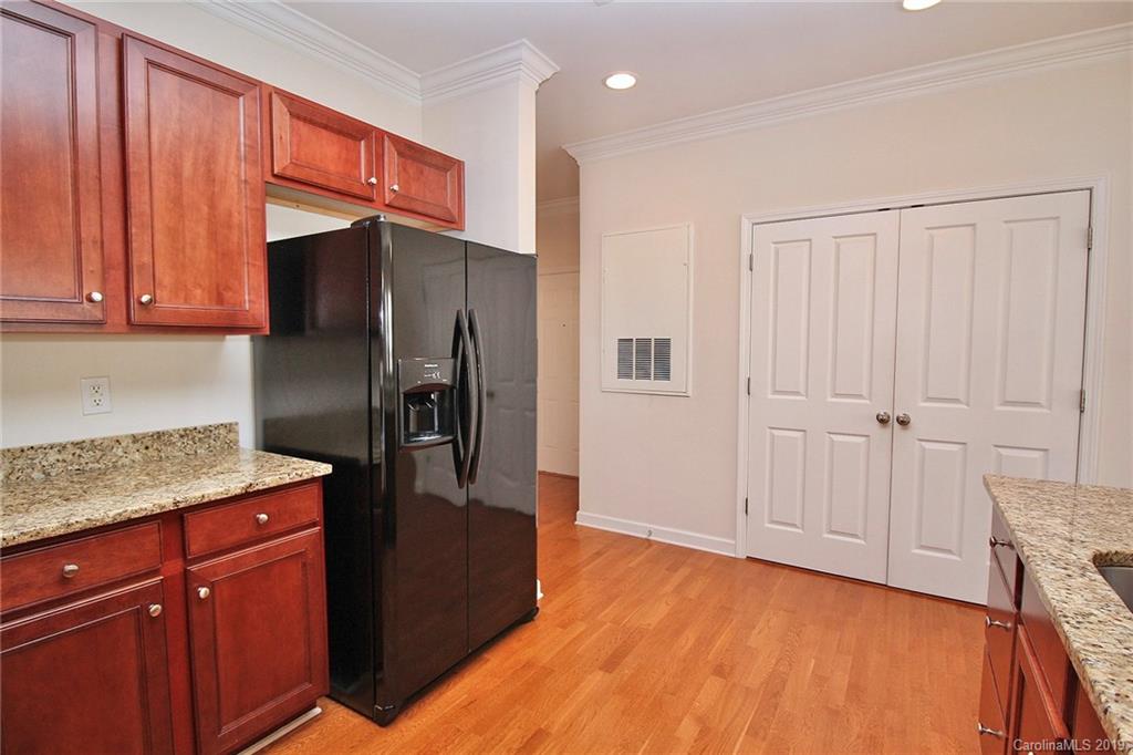 4154 Walker Road Charlotte, NC 28211 - Photo 19 of 37 a kitchen with stainless steel appliances granite countertop a refrigerator and a sink