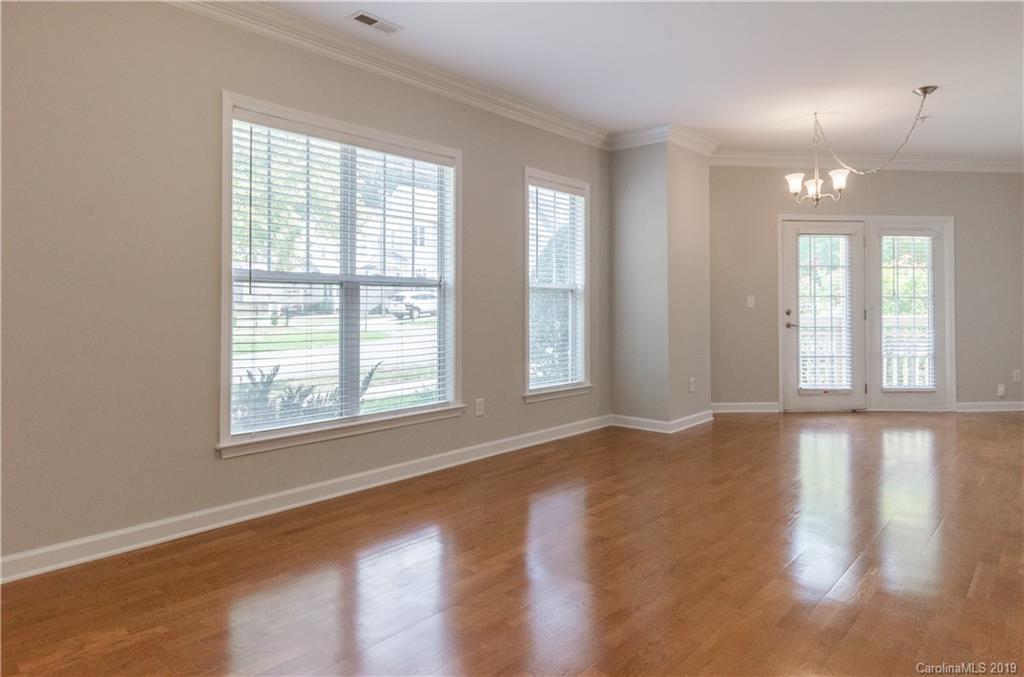 4154 Walker Road Charlotte, NC 28211 - Photo 24 of 37 a view of an empty room with wooden floor and a window