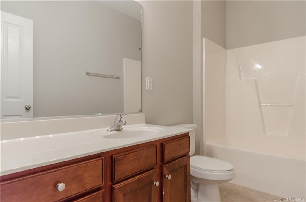4154 Walker Road Charlotte, NC 28211 - Photo 32 of 37 a bathroom with a sink toilet and shower