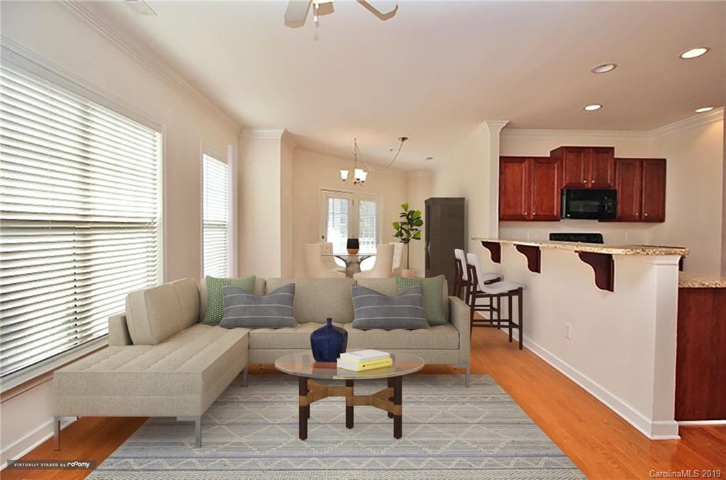 4154 Walker Road Charlotte, NC 28211 - Photo 8 of 37 a living room with furniture and a flat screen tv