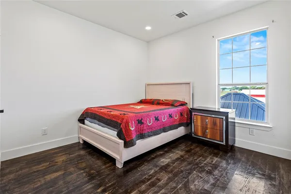 a bedroom with a bed and a cabinets