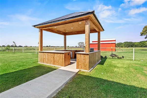 a view of a house with a yard and a backyard