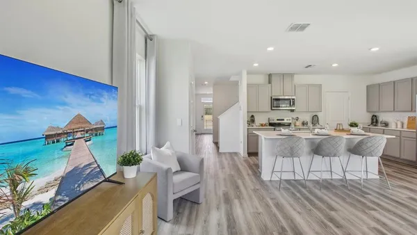 a view of kitchen with cabinets and wooden floor