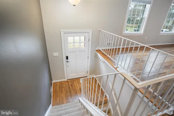 a view of entryway with wooden floor