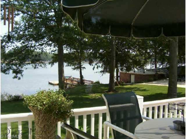 129 Doc Mcculloch Road Lexington, NC 27292 - Photo 9 of 9 Other. View of back yard, dock and boathouse from the deck. Front & back yards have watering system set up.
