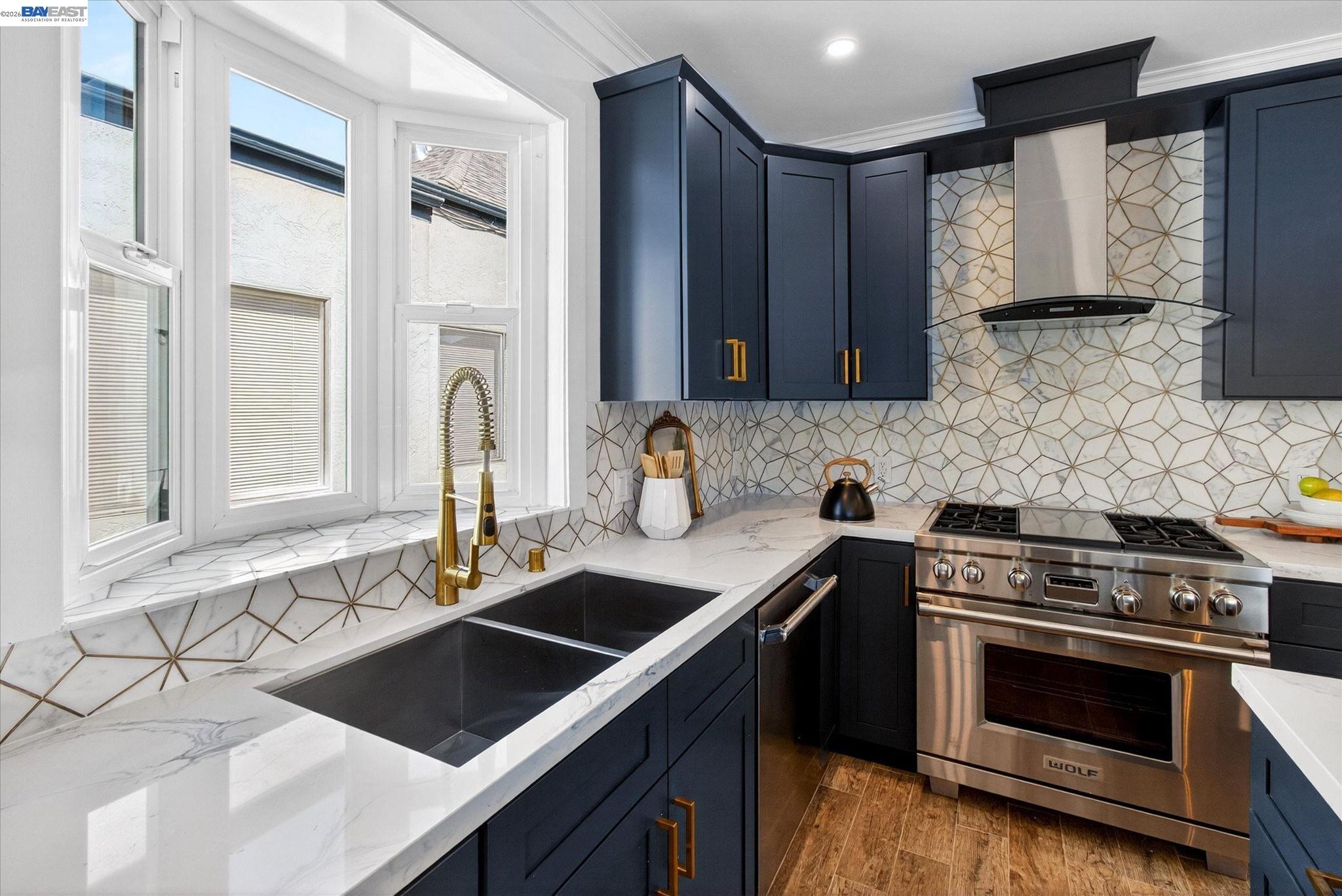 552 Haight Avenue Alameda, CA 94501 - Photo 15 of 43 a kitchen with stainless steel appliances a stove sink and cabinets