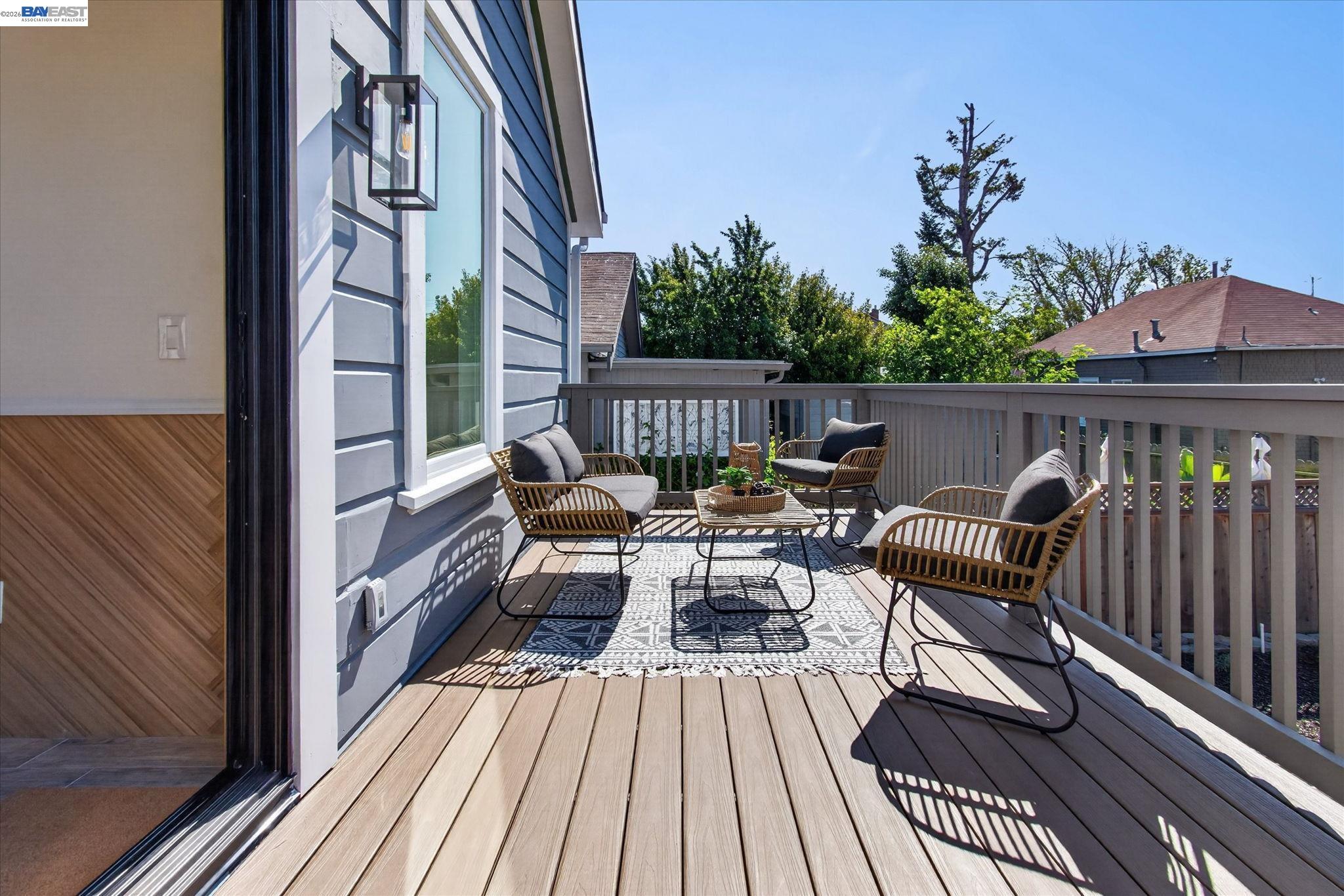 552 Haight Avenue Alameda, CA 94501 - Photo 18 of 43 a view of a balcony with two chairs and wooden floor