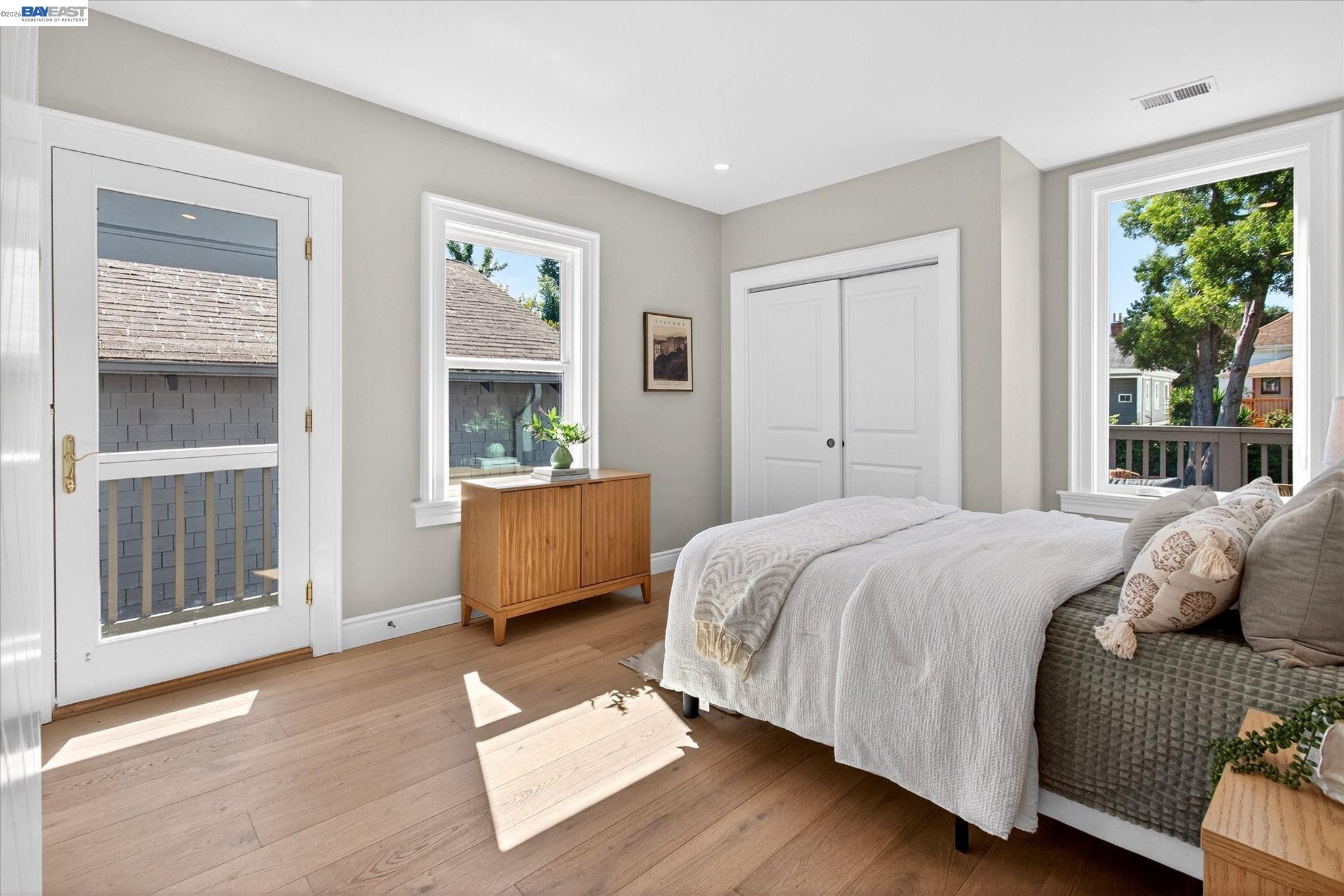 552 Haight Avenue Alameda, CA 94501 - Photo 21 of 43 a bedroom with a large bed windows and outer view