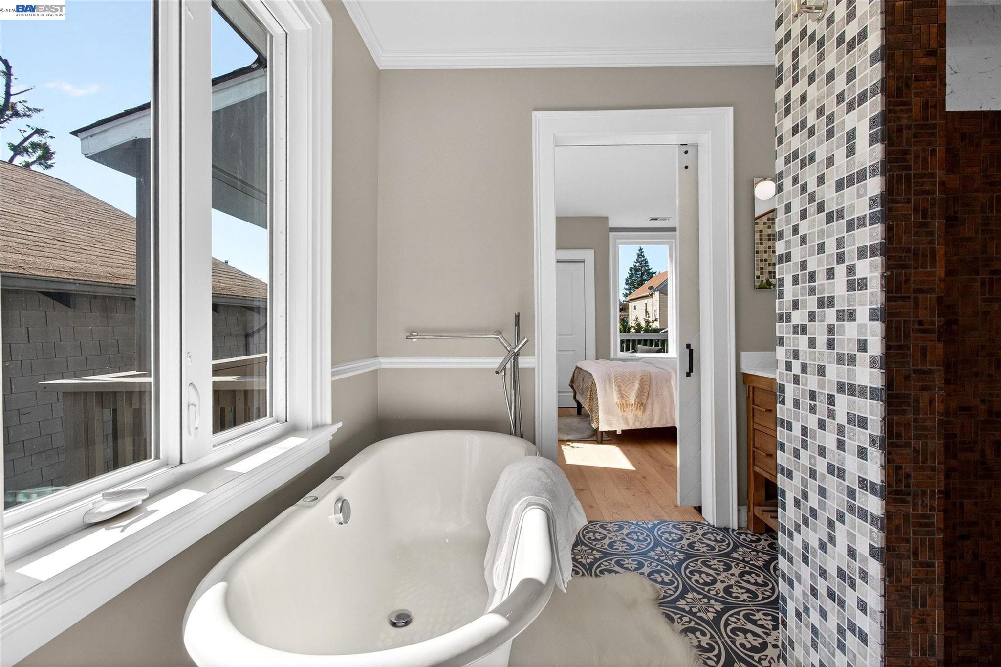 552 Haight Avenue Alameda, CA 94501 - Photo 24 of 43 a en suite bathroom with a bathtub and window
