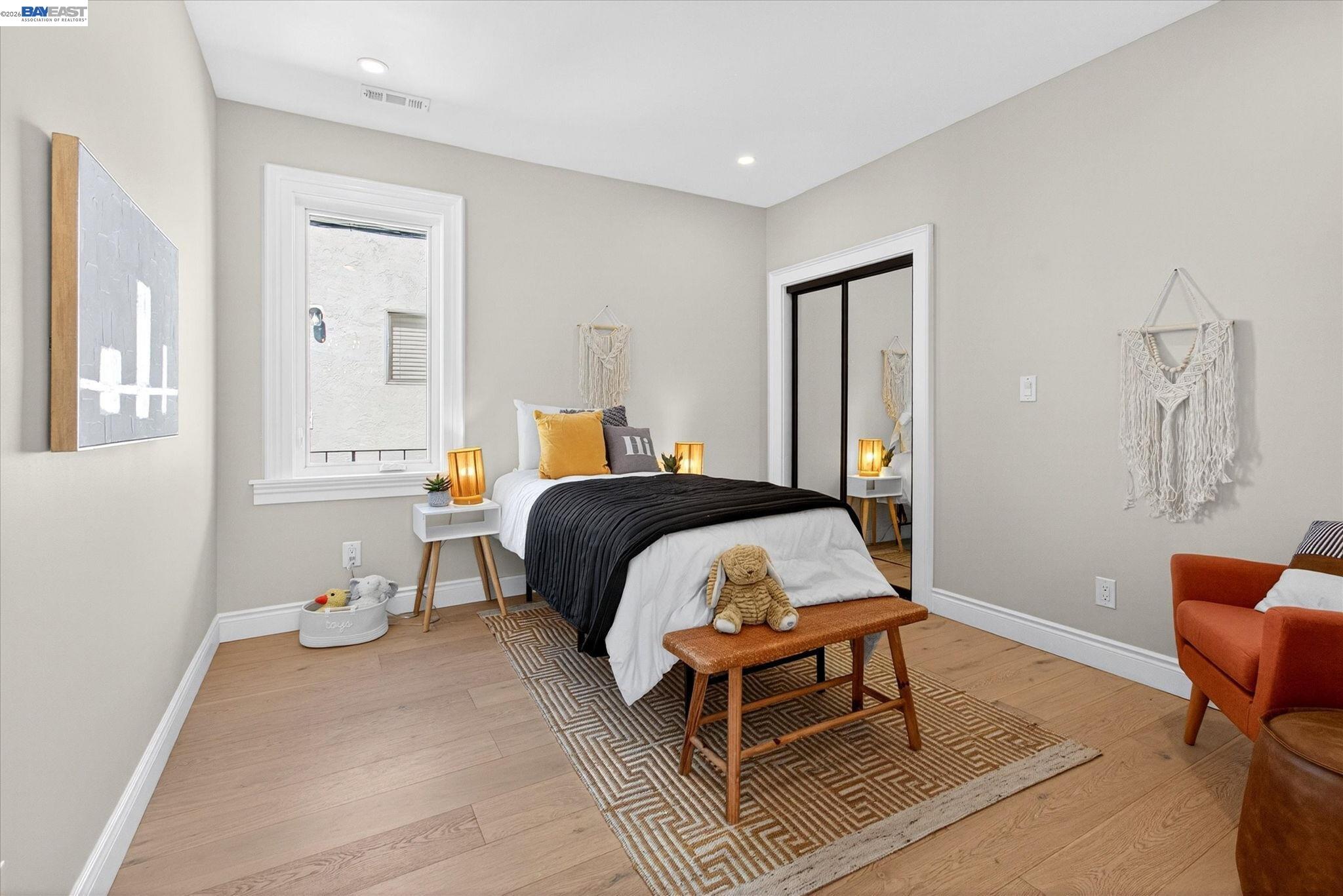 552 Haight Avenue Alameda, CA 94501 - Photo 26 of 43 a bedroom with a bed and chair