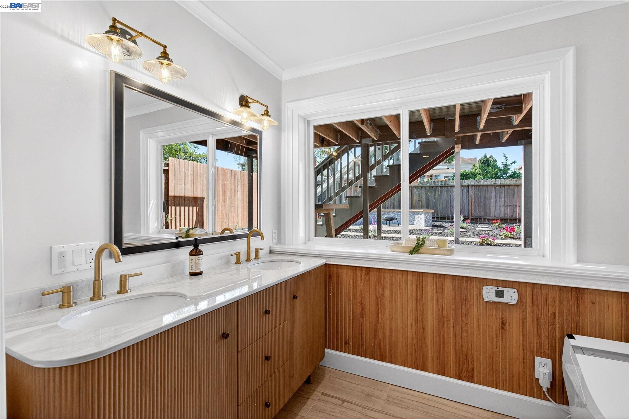 552 Haight Avenue Alameda, CA 94501 - Photo 35 of 43 a bathroom with a double vanity sink and a large mirror