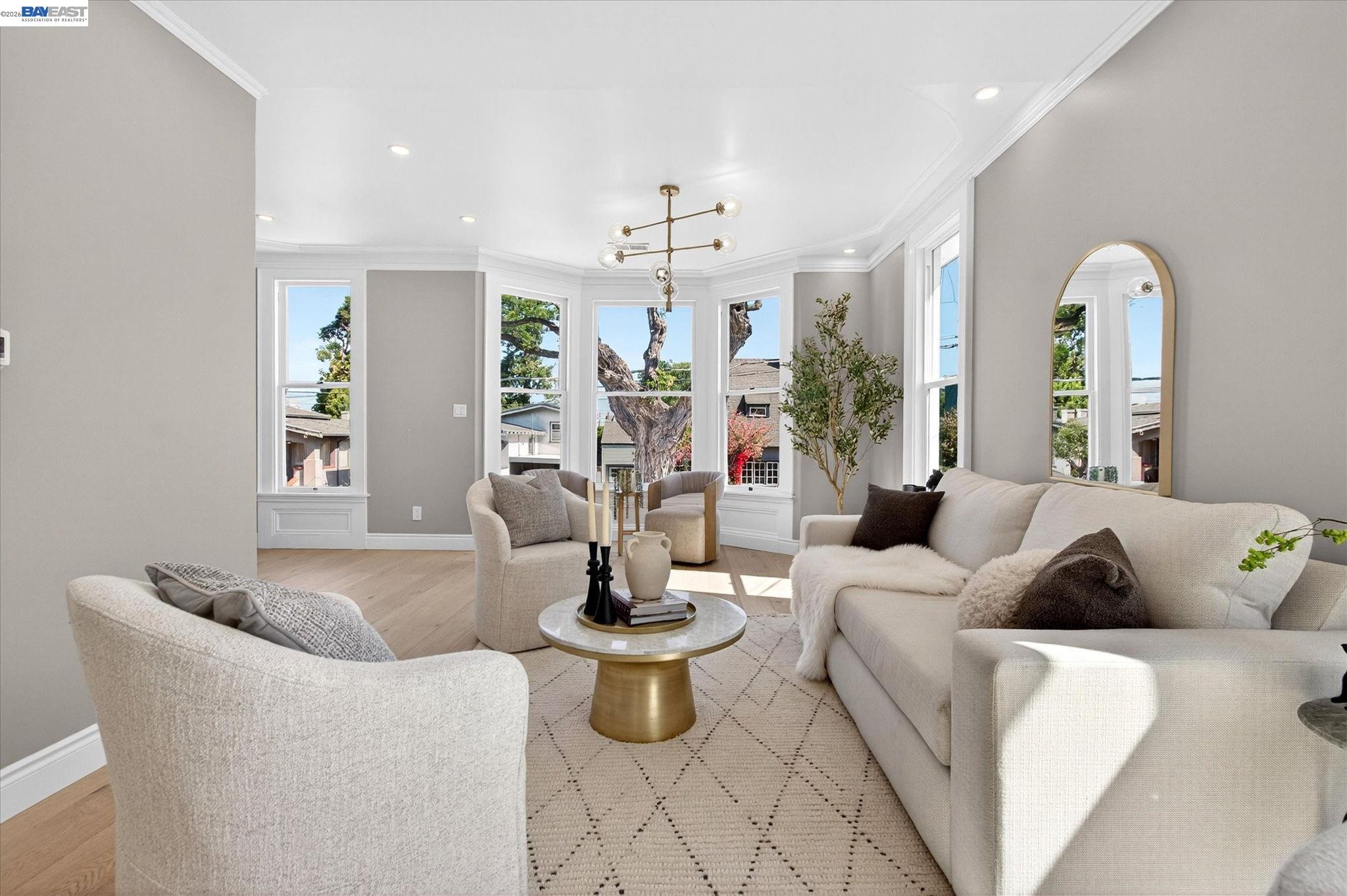 552 Haight Avenue Alameda, CA 94501 - Photo 9 of 43 a living room with furniture and a chandelier