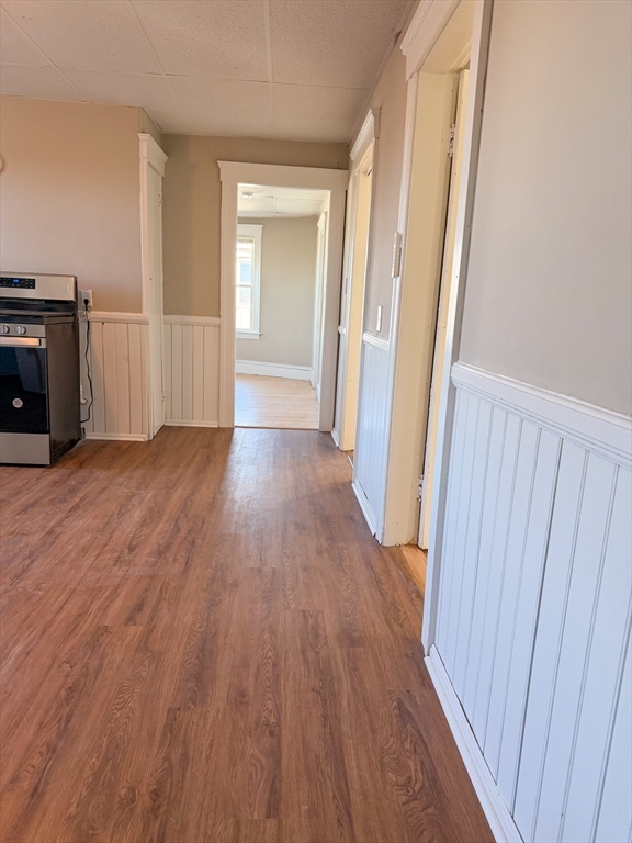 4 Vernon Terrace, Unit 3 Worcester, MA 01610 - Photo 4 of 9 a view of a hallway with wooden floor