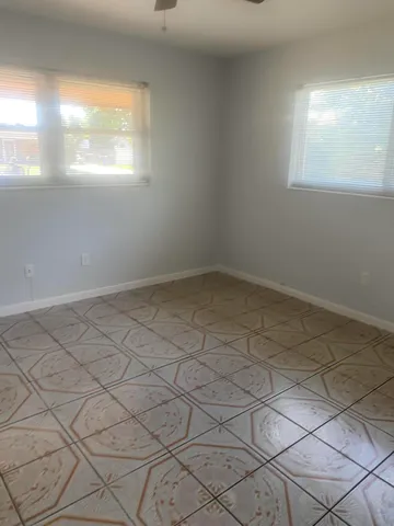 an empty room with windows