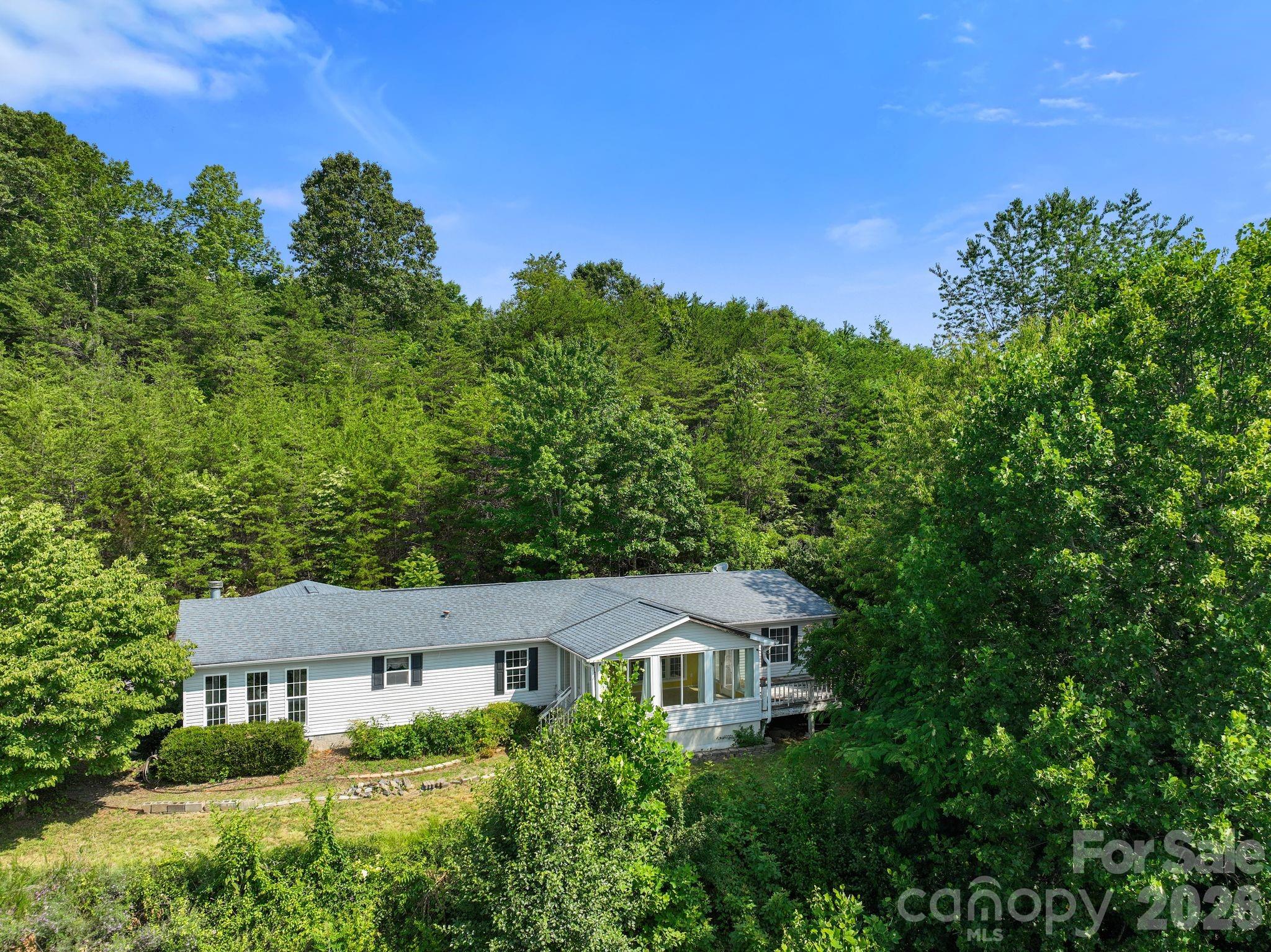 133 Spivey Mountain Road Asheville, NC 28806 - Photo 37 of 40 a house view with a garden space