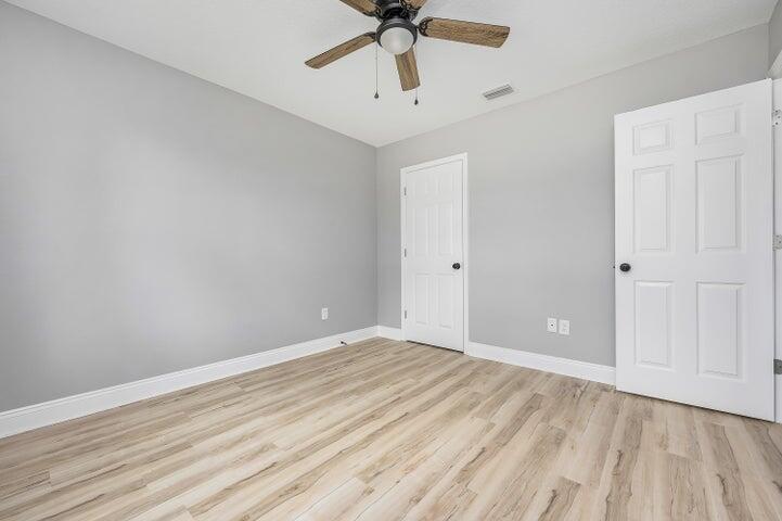 5428 Bayleaf Drive Crestview, FL 32539 - Photo 18 of 23 wooden floor in an empty room