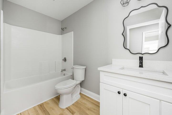 5428 Bayleaf Drive Crestview, FL 32539 - Photo 19 of 23 a bathroom with a granite countertop sink toilet and shower