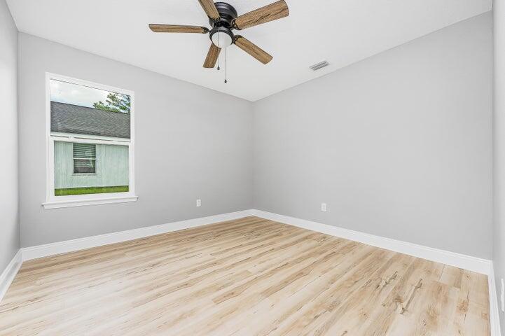 5428 Bayleaf Drive Crestview, FL 32539 - Photo 21 of 23 wooden floor in an empty room