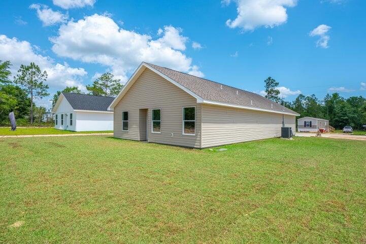 5428 Bayleaf Drive Crestview, FL 32539 - Photo 22 of 23 a view of a house with backyard and garden
