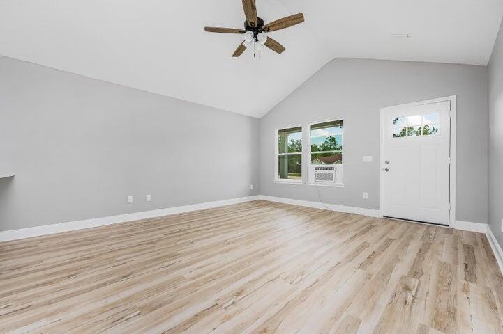 5428 Bayleaf Drive Crestview, FL 32539 - Photo 4 of 23 wooden floor in an empty room with a window