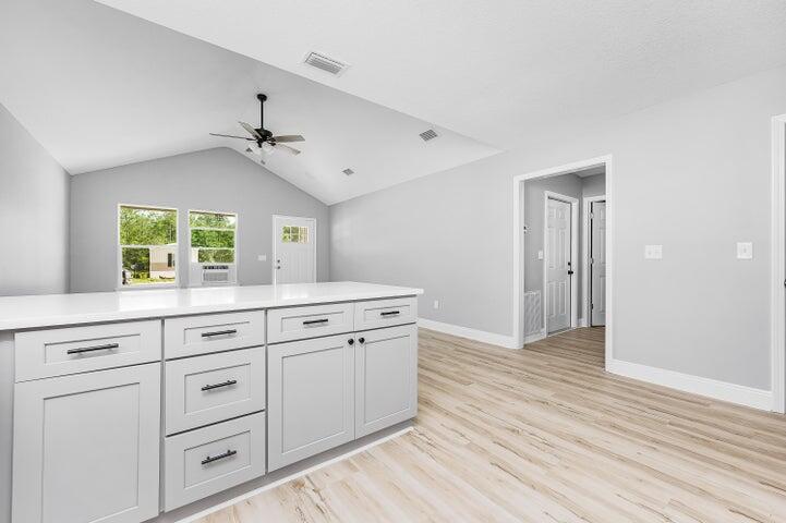 5428 Bayleaf Drive Crestview, FL 32539 - Photo 10 of 23 a view of cabinets a wooden floor with windows
