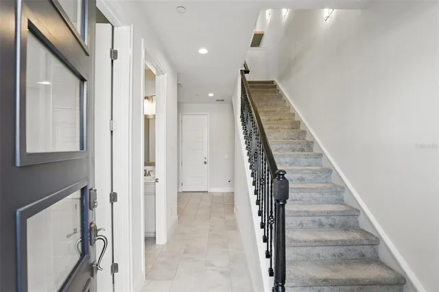 a view of a hallway with staircase