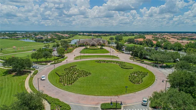 an aerial view of a house with a swimming pool
