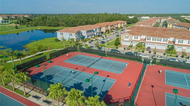 an aerial view of residential houses with outdoor space and street view