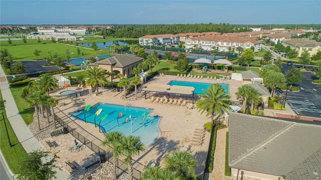 an aerial view of residential houses with outdoor space
