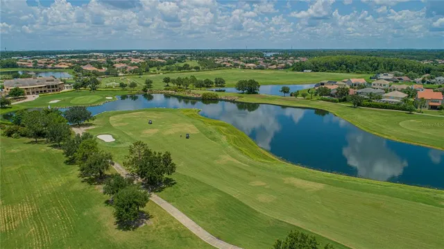 a view of a lake with a yard