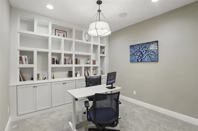 a workspace with furniture and a chandelier