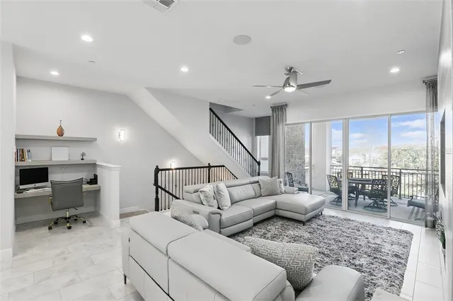 a living room with furniture and a table