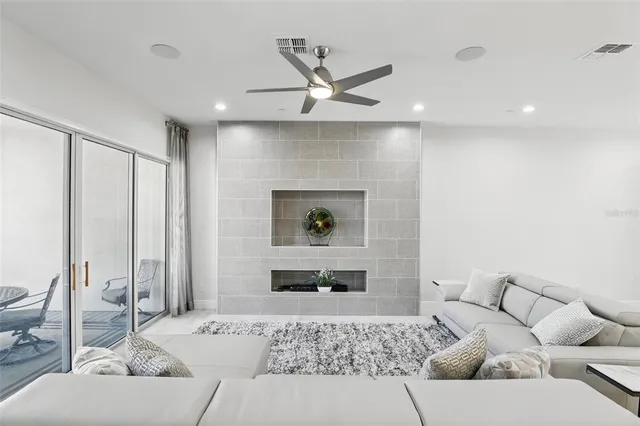 a living room with furniture and a large window