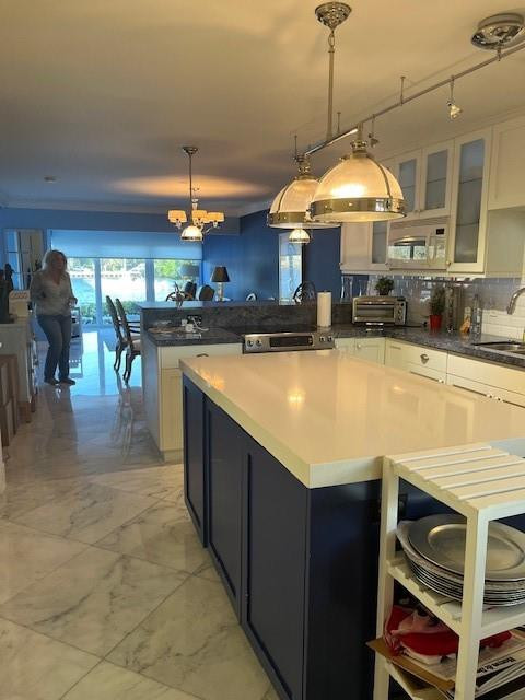 2758 Northeast 30th Avenue, Unit 3A Lighthouse Point, FL 33064 - Photo 13 of 29 Kitchen Island