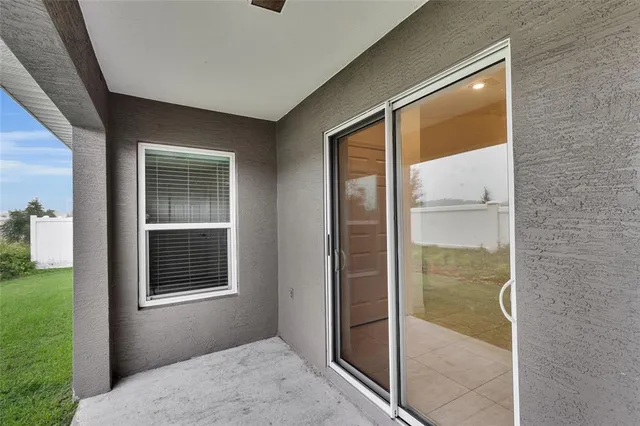 a balcony view with a glass door