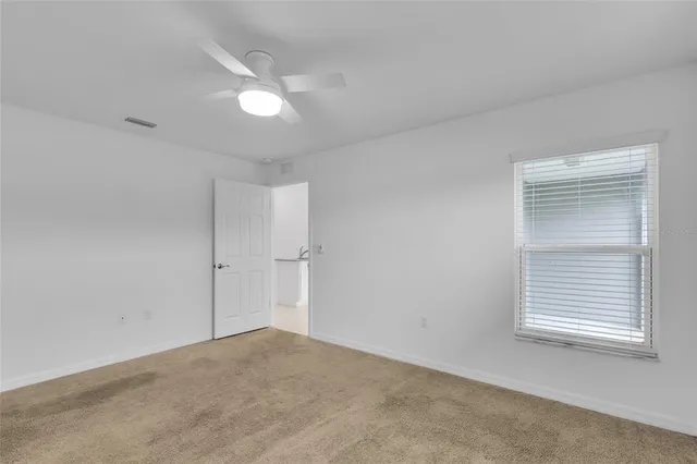 a view of an empty room with a window