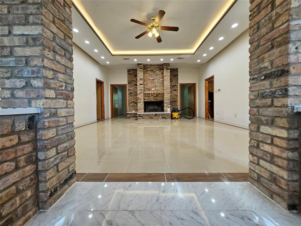 234 East Fork Road Sunnyvale, TX 75182 - Photo 3 of 32 a view of a livingroom with a fireplace and window