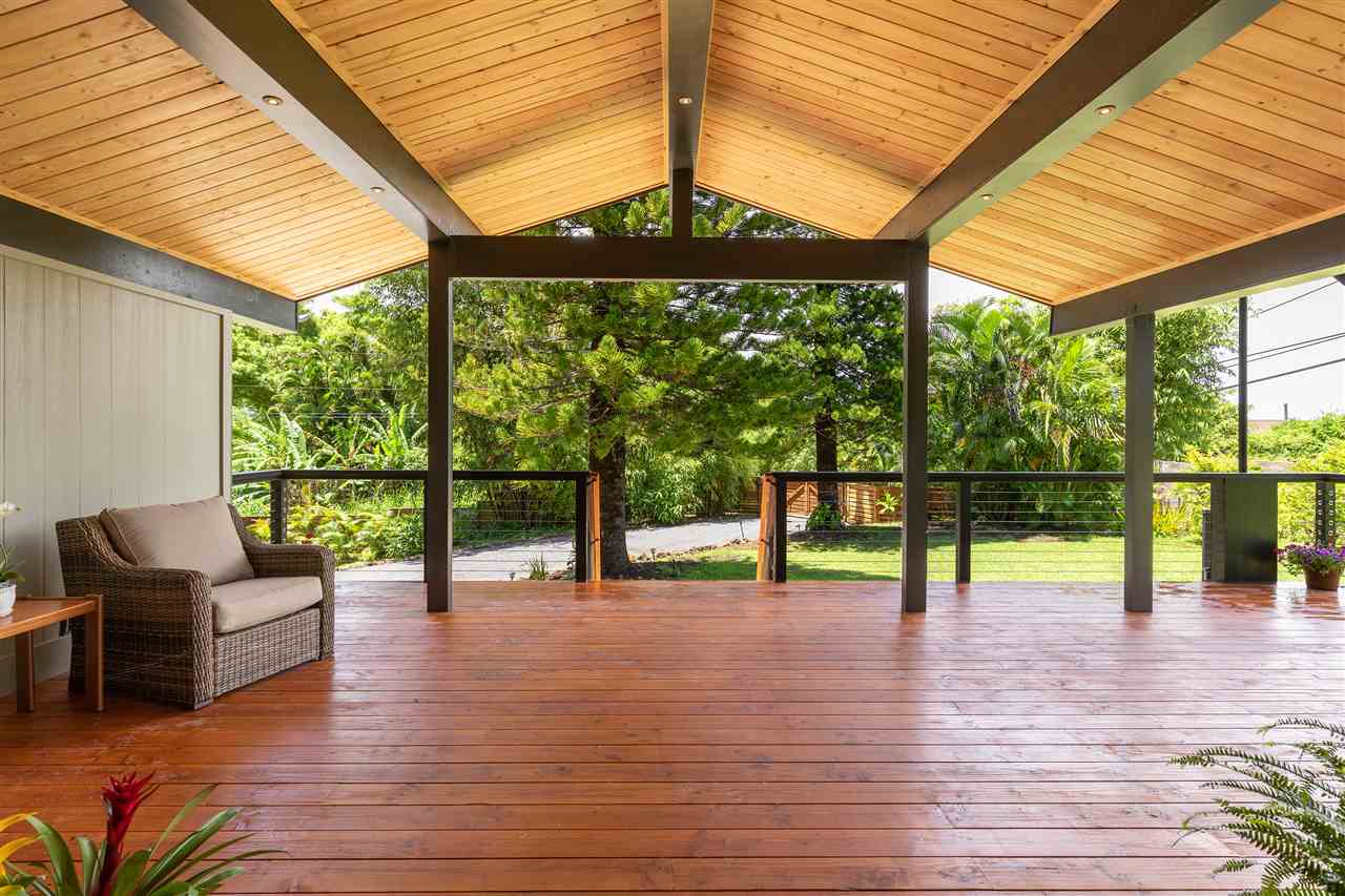 500 Ulumalu Road, Unit A Haiku, HI 96708 - Photo 5 of 30 a view of a patio with a table chairs and wooden floor