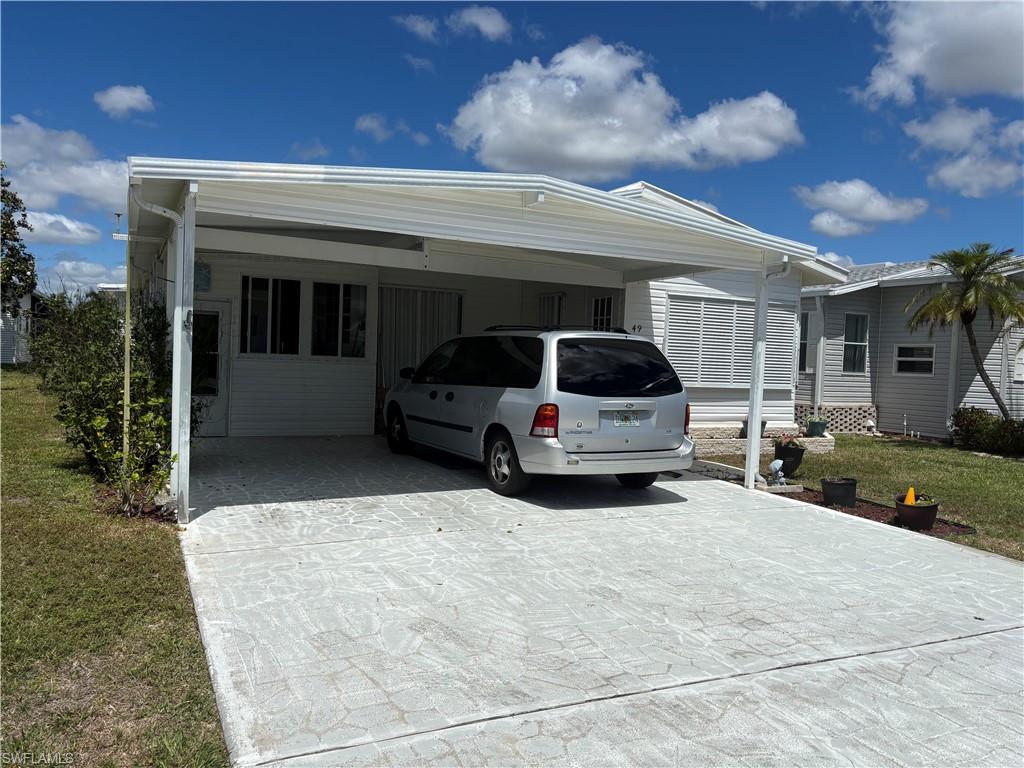 a view of a car in front of house