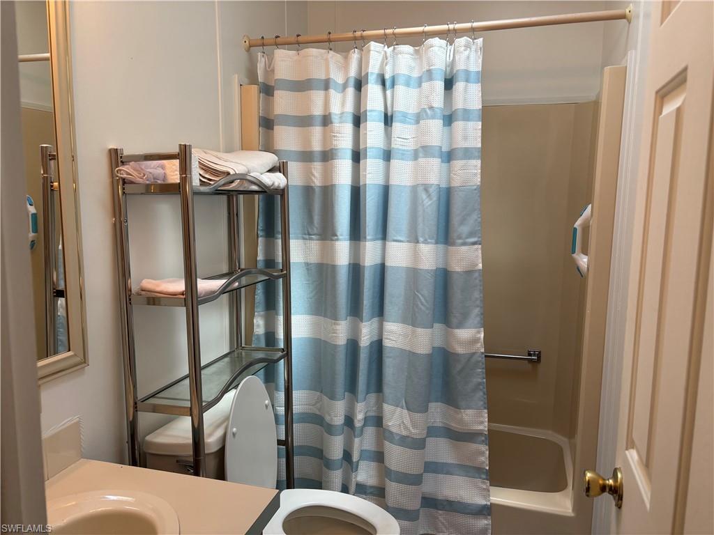 49 Turquoise Avenue, Unit 49T Naples, FL 34114 - Photo 15 of 29 a bathroom with a shower
