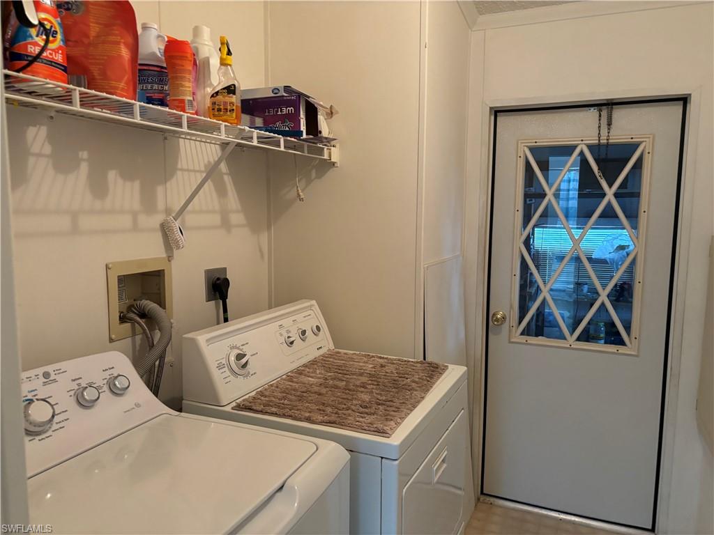 49 Turquoise Avenue, Unit 49T Naples, FL 34114 - Photo 16 of 29 a utility room with dryer and washer