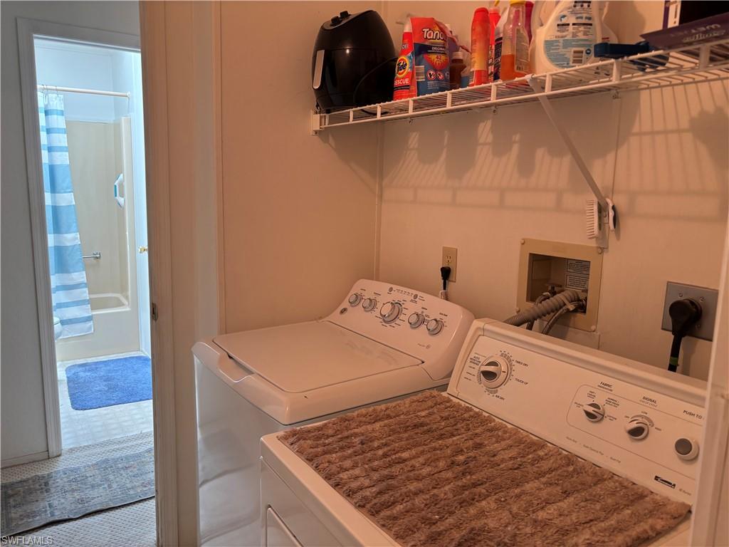 49 Turquoise Avenue, Unit 49T Naples, FL 34114 - Photo 22 of 29 a utility room with dryer and washer
