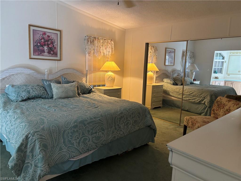 49 Turquoise Avenue, Unit 49T Naples, FL 34114 - Photo 23 of 29 a bedroom with bed and window