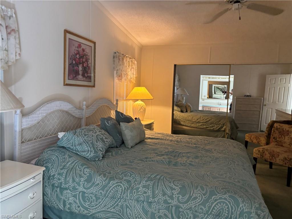 49 Turquoise Avenue, Unit 49T Naples, FL 34114 - Photo 27 of 29 a bedroom with a bed and window