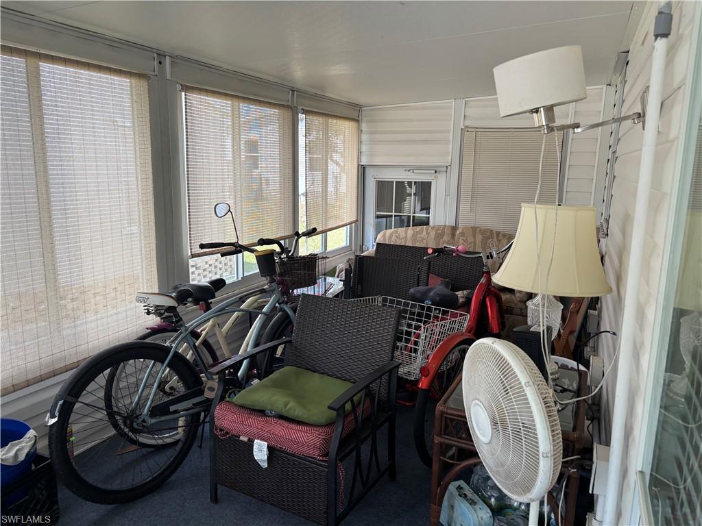 49 Turquoise Avenue, Unit 49T Naples, FL 34114 - Photo 29 of 29 a view of a livingroom with furniture and a window